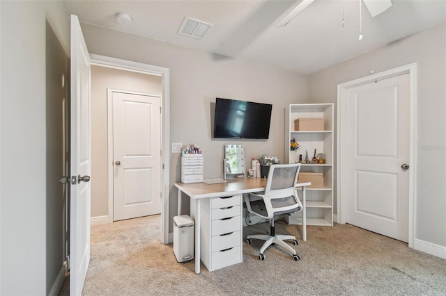 office space with light carpet and ceiling fan