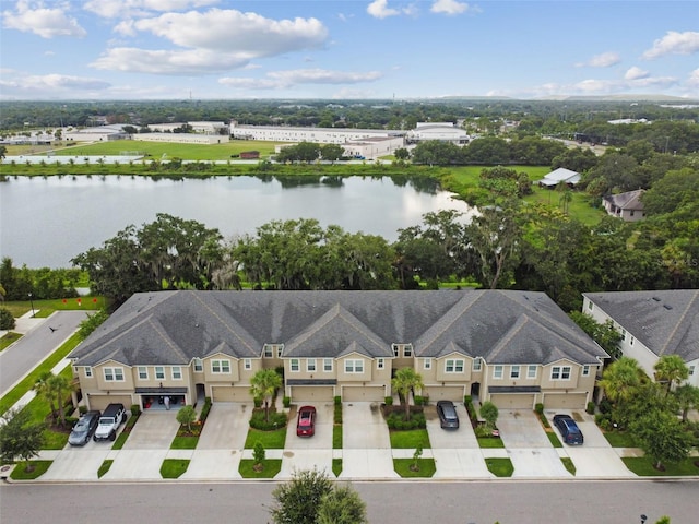 birds eye view of property with a water view