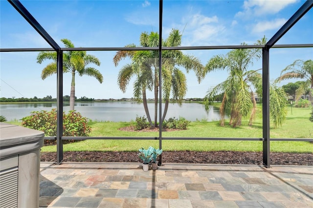 unfurnished sunroom with a water view