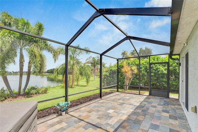 unfurnished sunroom with a water view