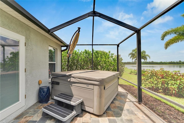 sunroom / solarium with a water view