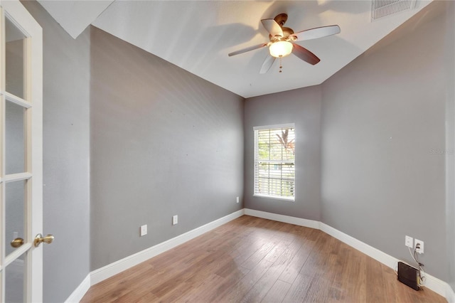 empty room featuring hardwood / wood-style flooring and ceiling fan