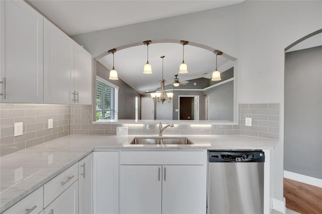 kitchen with white cabinetry, dishwasher, sink, and backsplash