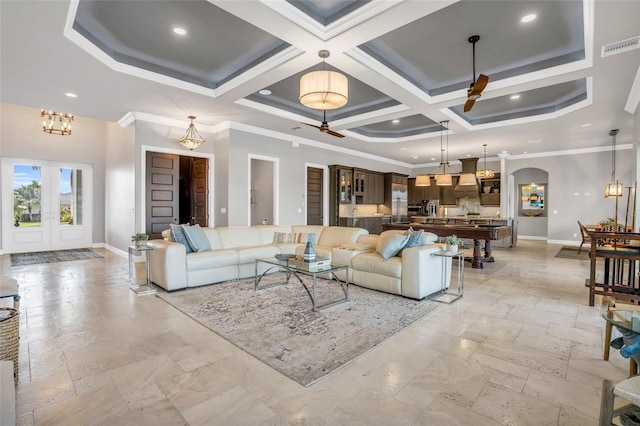 living room featuring coffered ceiling, ceiling fan with notable chandelier, crown molding, and a high ceiling