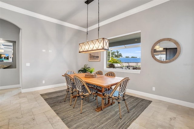 dining space featuring ornamental molding