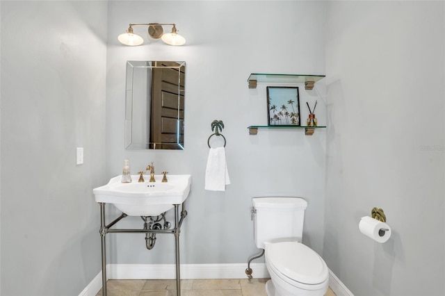 bathroom featuring tile patterned floors and toilet