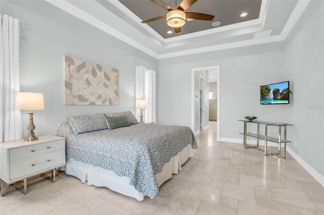 bedroom with crown molding, ceiling fan, and a tray ceiling