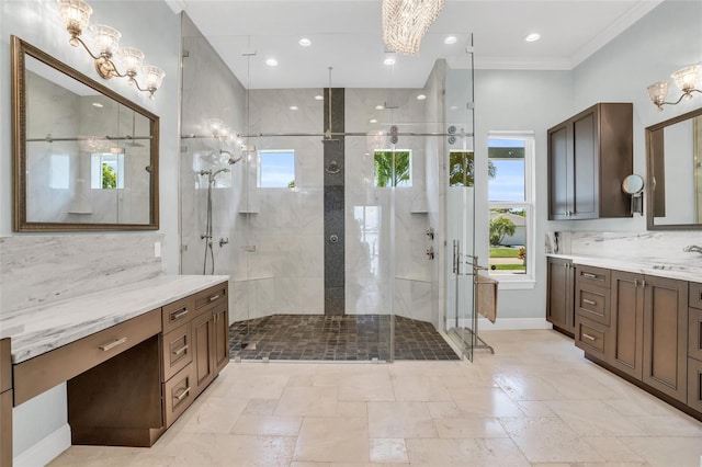 bathroom with a tile shower, tasteful backsplash, vanity, a notable chandelier, and crown molding