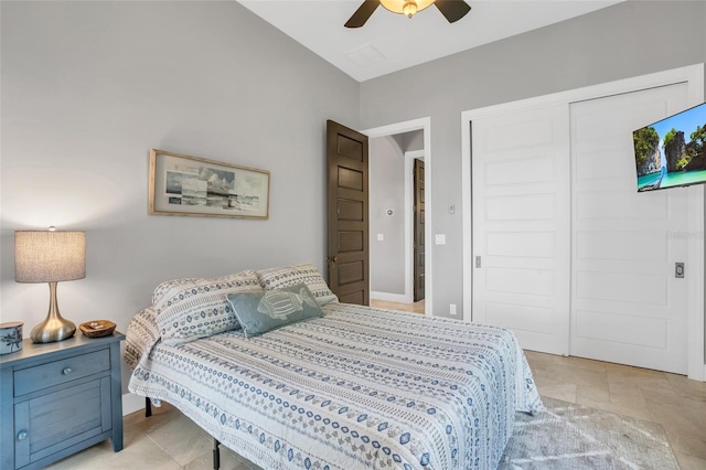 bedroom featuring ceiling fan and a closet