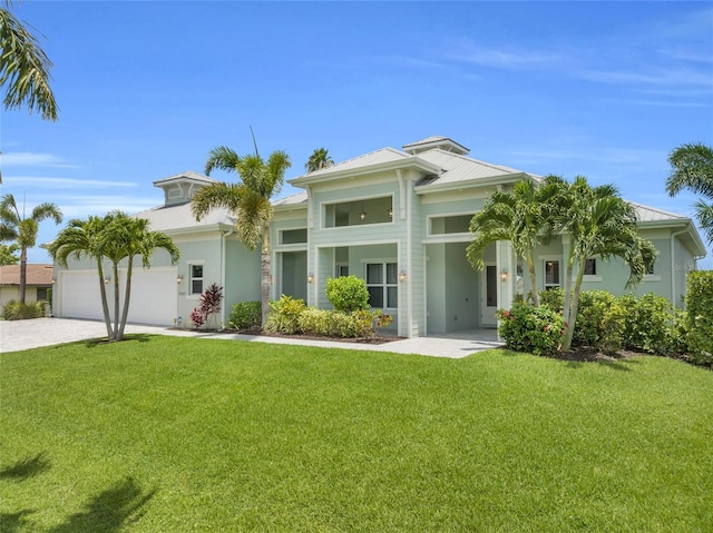 view of front facade with a garage and a front yard