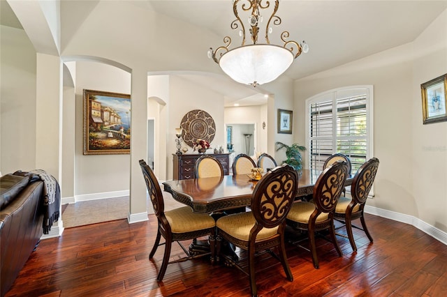 dining area with lofted ceiling and hardwood / wood-style flooring