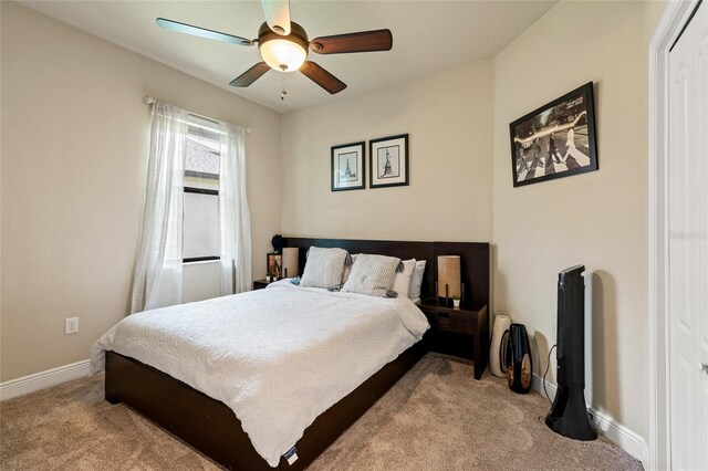 carpeted bedroom featuring ceiling fan