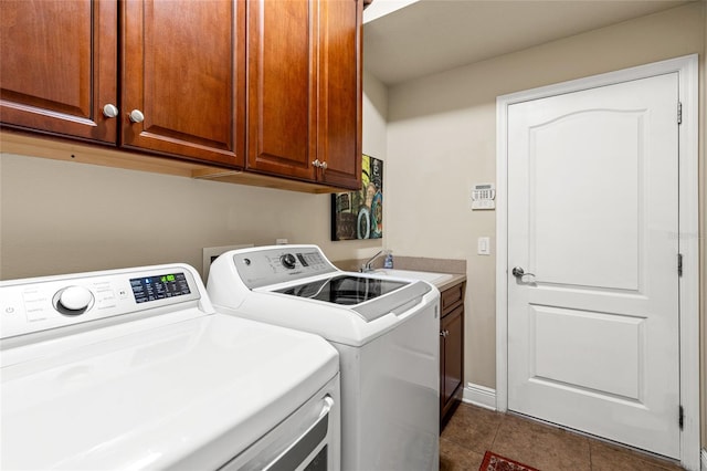 laundry room with separate washer and dryer, tile patterned floors, sink, and cabinets