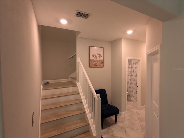 stairs with tile patterned flooring