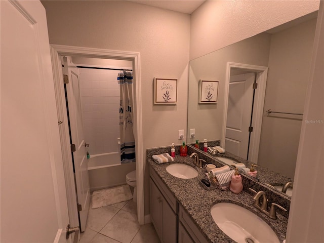 full bathroom with tile patterned floors, toilet, shower / bath combination with curtain, and vanity