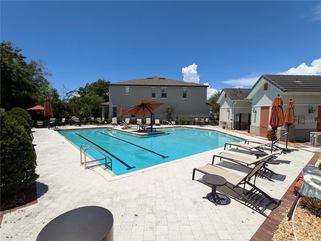 view of swimming pool featuring a patio