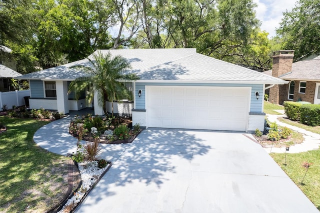 ranch-style house featuring a garage