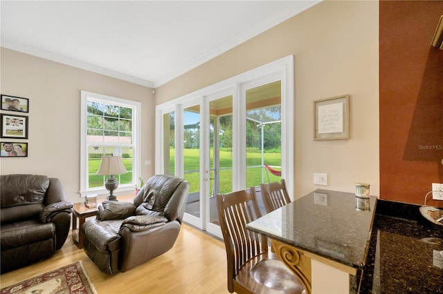 interior space featuring ornamental molding, light hardwood / wood-style flooring, and french doors