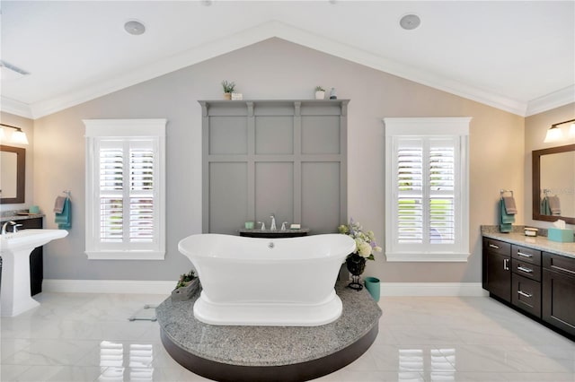 bathroom with crown molding, a bath, vaulted ceiling, and a wealth of natural light