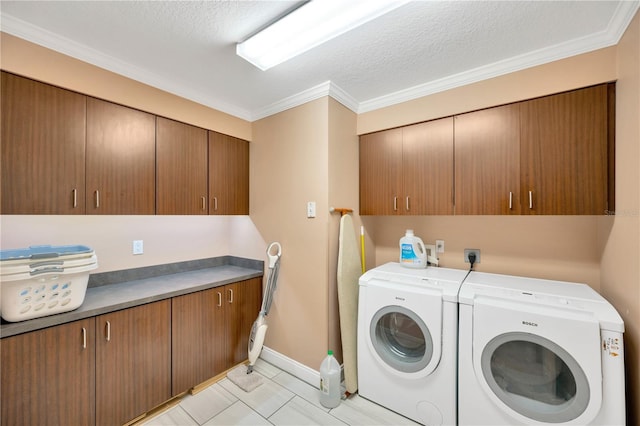 laundry area featuring crown molding, independent washer and dryer, cabinets, a textured ceiling, and light tile patterned flooring