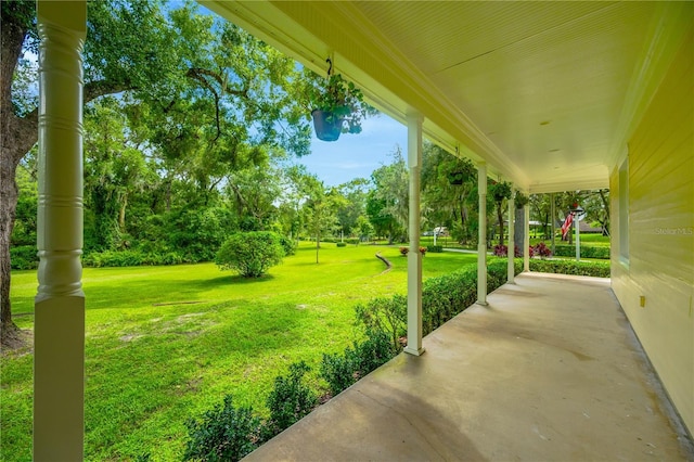 view of yard with covered porch