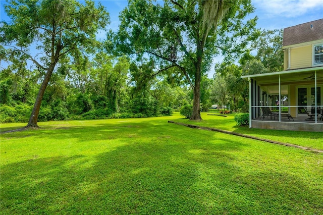 view of yard with a sunroom