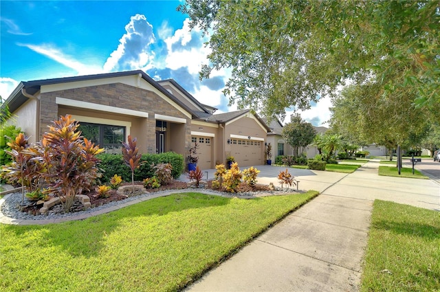 view of front of home featuring a garage and a front lawn