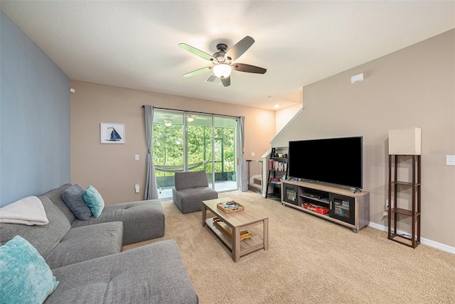 living room with ceiling fan and light colored carpet