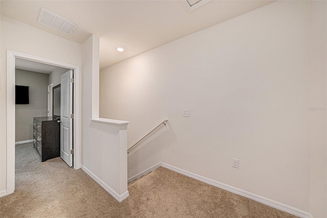 hallway with light carpet