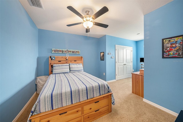 carpeted bedroom with ceiling fan