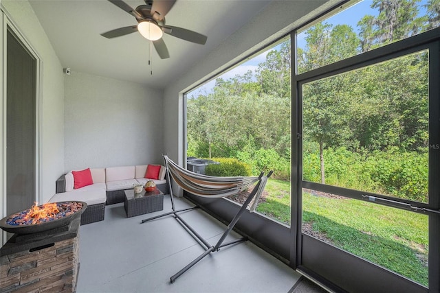 sunroom / solarium with ceiling fan