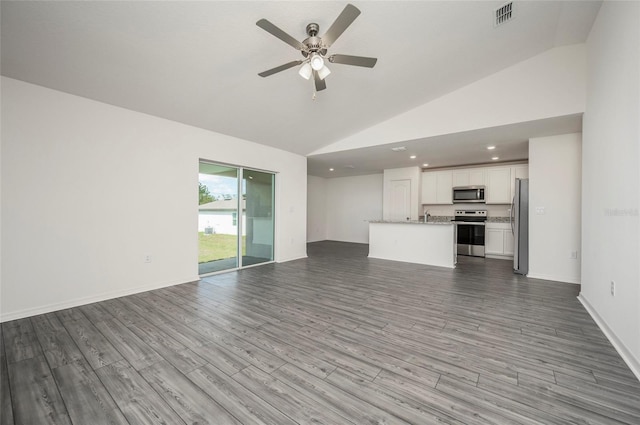 unfurnished living room with sink, wood-type flooring, high vaulted ceiling, and ceiling fan