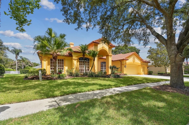 mediterranean / spanish-style house featuring a front lawn