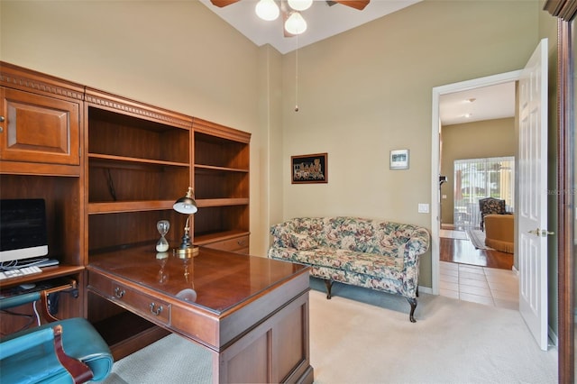 office area with light colored carpet and ceiling fan