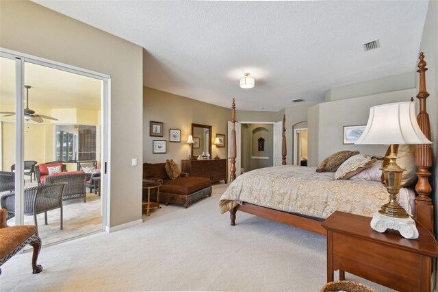 carpeted bedroom with a textured ceiling