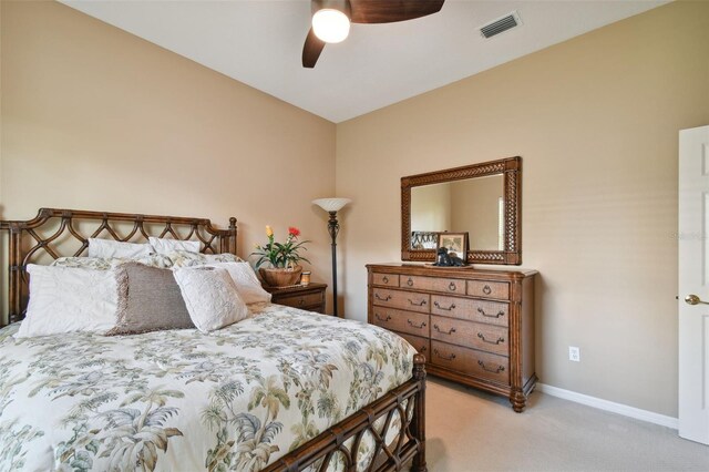 bedroom with light carpet and ceiling fan