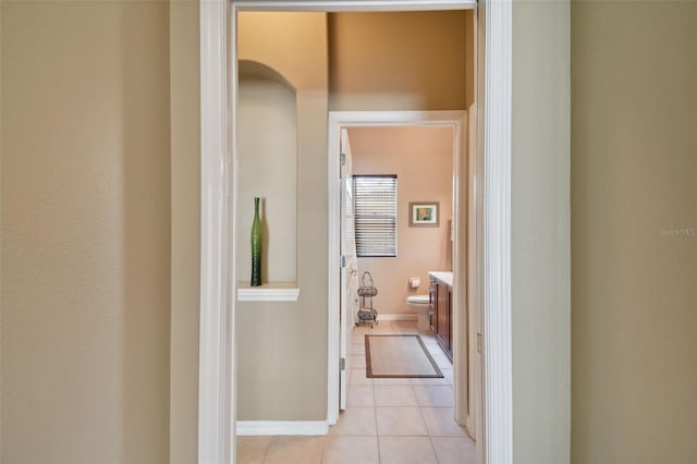 hallway featuring light tile patterned flooring