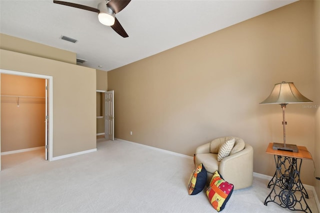 interior space with carpet and ceiling fan