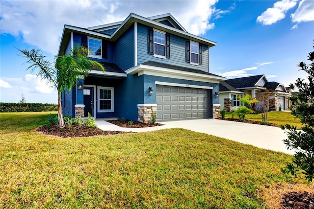 view of front of home featuring a front lawn and a garage