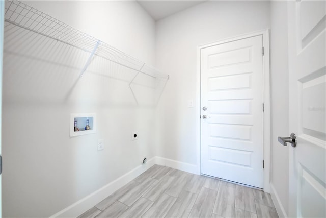 washroom with washer hookup, hookup for an electric dryer, and light wood-type flooring