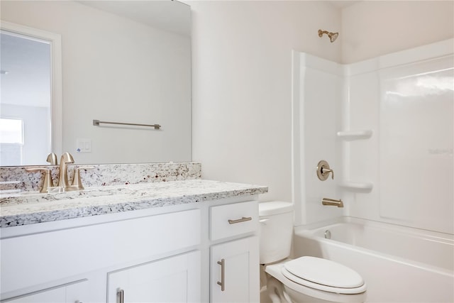 full bathroom with vanity, shower / bathtub combination, and toilet