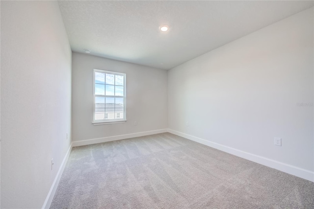 empty room with light colored carpet