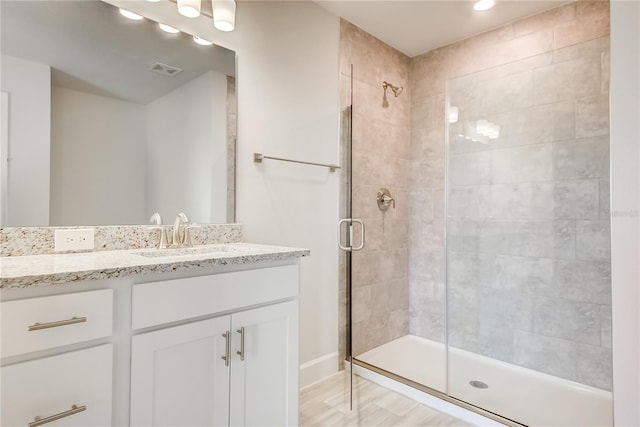 bathroom featuring vanity and walk in shower