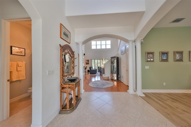 tiled foyer entrance with decorative columns