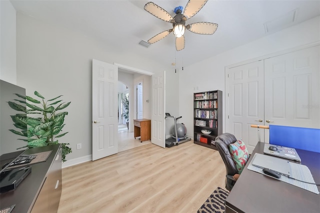 office space featuring ceiling fan and light hardwood / wood-style flooring