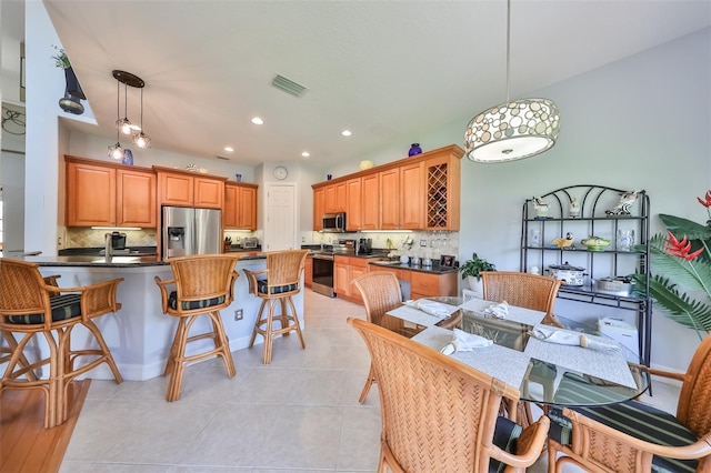 dining area with light tile patterned floors