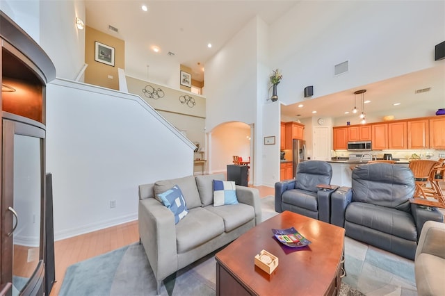 living room with a high ceiling