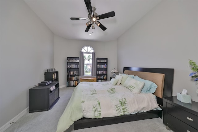 bedroom with light carpet and ceiling fan