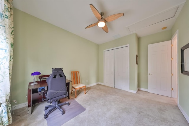 office area featuring ceiling fan and light colored carpet