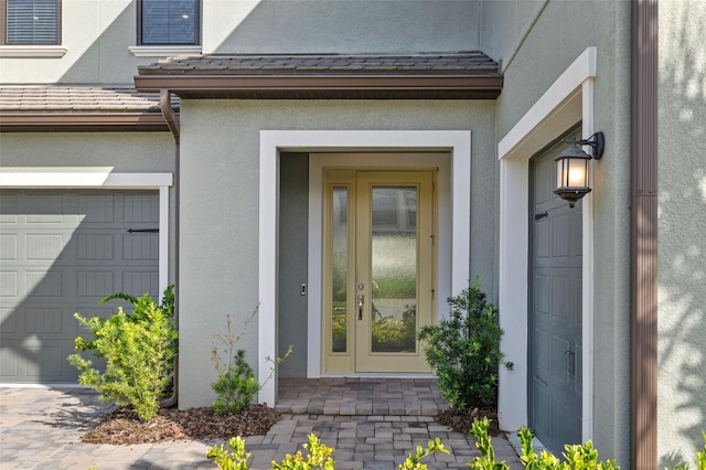 doorway to property featuring a garage